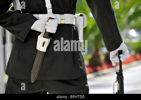 Backside of soldier on guard outside Dolmabahce Palace, Istanbul, Turkey. Right hand holds a gun and left hand conceals dagger behind his back. Stock Photo