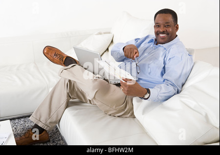Cheerful Senior Man Using Laptop Stock Photo