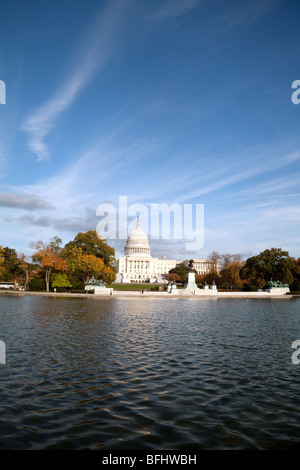 The Capitol building seen across the reflecting pool in autumn, National Mall, Washington DC, USA Stock Photo