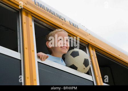 Boy on School Bus Stock Photo