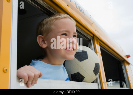 Boy on School Bus Stock Photo