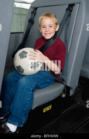 Elementary Student on School Bus Stock Photo