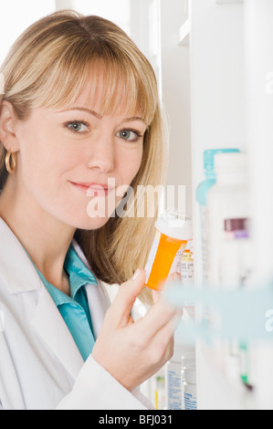 Female pharmactist working in pharmacy Stock Photo