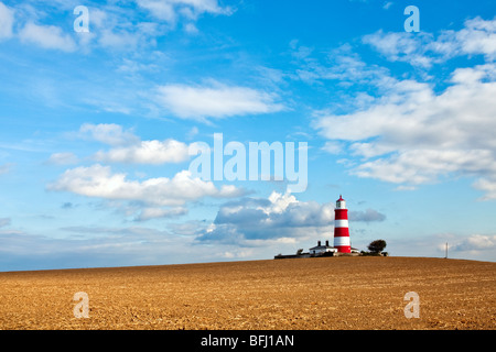 Happisburgh Lighthouse against a bright vibrant sky on the Norfolk Coast Stock Photo