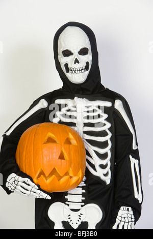 Download Portrait Of Boy 7 9 Wearing Skeleton Mask With Jack O Lantern Stock Photo Alamy PSD Mockup Templates