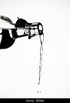 Emptying out a bottle. Stock Photo