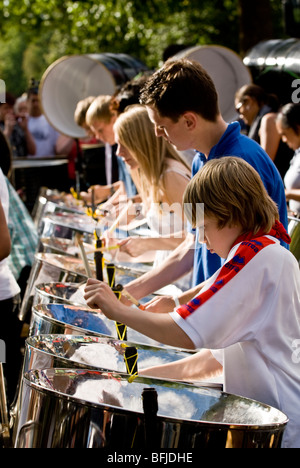 Steel drummers from the Croydon Steel Orchestra playing steel drums at the Notting Hill Panorama Championships in Hyde Park. Stock Photo