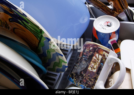 Dishes in drying rack after washing Stock Photo
