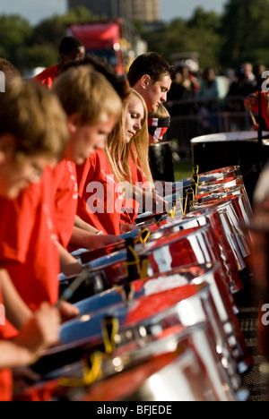 Steel drummers from the Croydon Steel Orchestra playing steel drums at the Notting Hill Panorama Championships in Hyde Park. Stock Photo