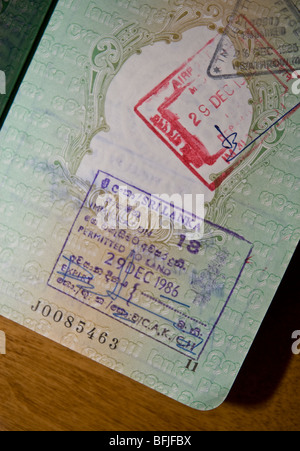 International immigration stamps and visas in a passport Stock Photo