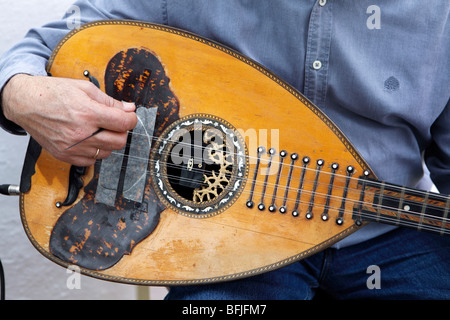 GREECE CYCLADES SIKINOS MUSICIAN PLAYING AN OLD LUTE Stock Photo