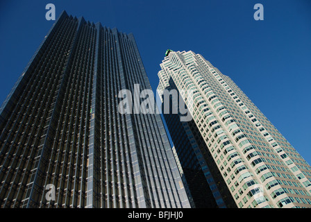 A tall office building and a multi-unit residential condo building co-exist in the business district of downtown Toronto Canada Stock Photo