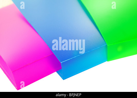 three multicolored folders on white background Stock Photo
