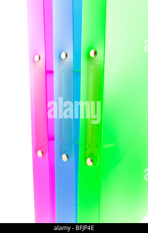 three multicolored folders on white background Stock Photo