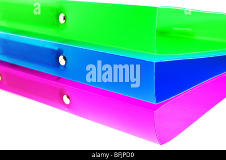 three multicolored folders on white background Stock Photo