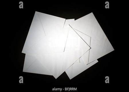 closed envelopes with white spot light on black background Stock Photo