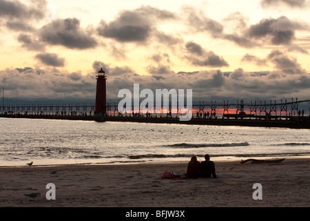 Silhouette of couple on beach at Muskegon State Park Stock Photo