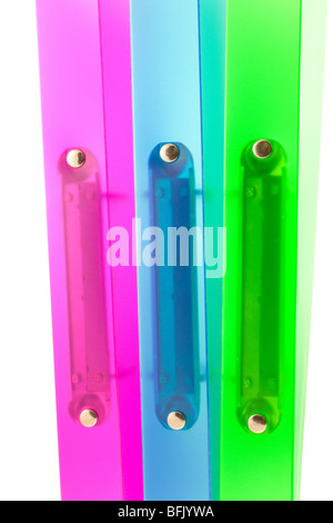 three multicolored folders on white background Stock Photo