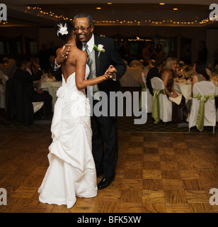 African bride and father dancing at wedding reception Stock Photo