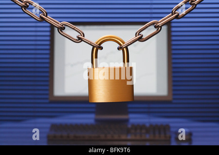 Pad lock in front of desktop PC Stock Photo
