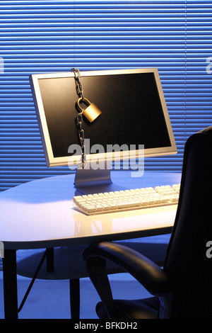 Computer wrapped in chain Stock Photo
