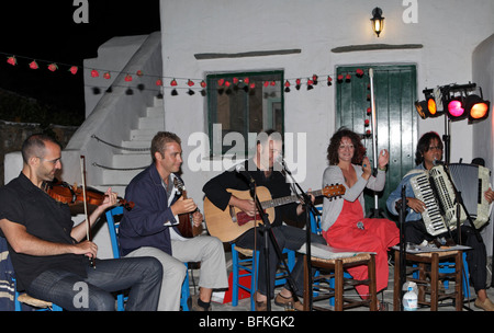 GREECE CYCLADES SIKINOS MUSICIANS PLAYING TRADITIONAL ISLAND MUSIC AT A WEDDING Stock Photo