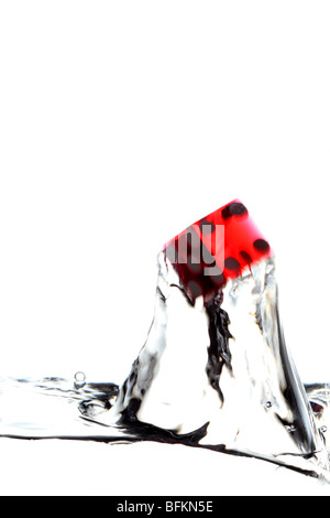 red dice diving water splash luck Stock Photo