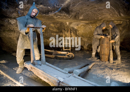 Model figures depict miners mining rock salt in the Wieliczka Salt Mine. Near Krakow, Poland. Stock Photo