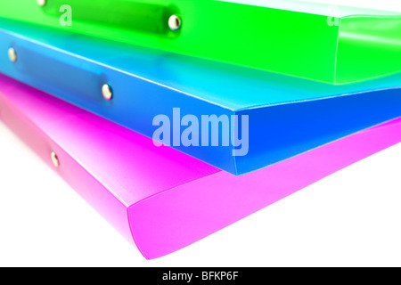three multicolored folders on white background. small GRIP Stock Photo