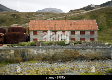 Old dormitory building next to oil storage tanks, Grytviken, South Georgia Island Stock Photo