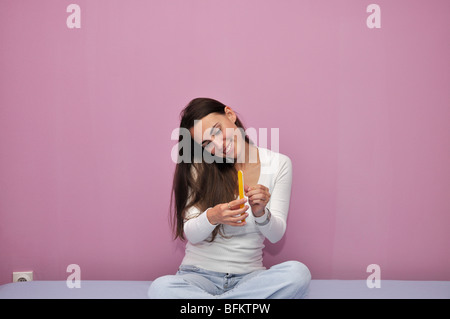 Young woman using cell phone Stock Photo