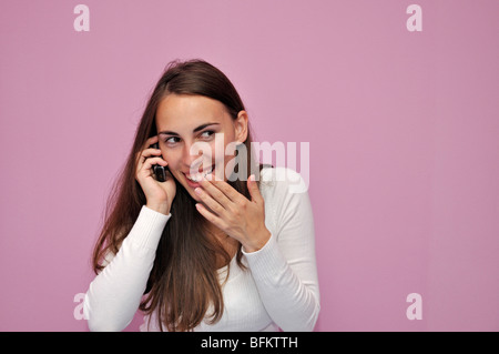 Young woman using cell phone Stock Photo