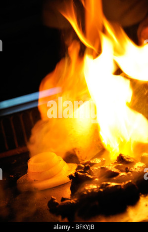 'Volcano fire' made of onion at Japanese Hibachi Grill restaurant Stock Photo