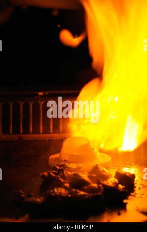 'Volcano fire' made of onion at Japanese Hibachi Grill restaurant Stock Photo