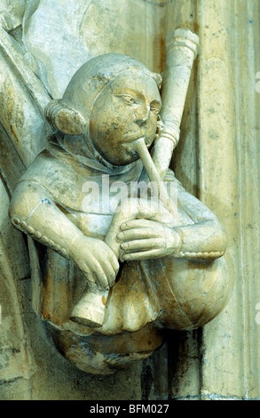 Beverley Minster, carved stone musician bagpipe bagpipes Medieval music musicians instrument musical instruments Humberside Stock Photo
