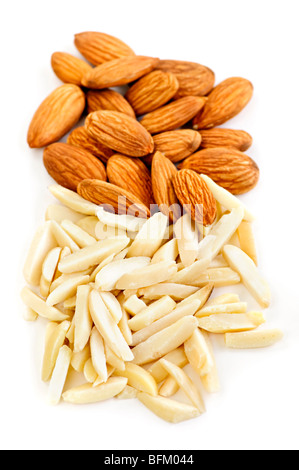 Whole and slivered raw almonds in a pile on white background Stock Photo
