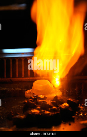 'Volcano fire' made of onion at Japanese Hibachi Grill restaurant Stock Photo