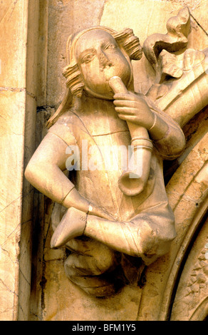 Beverley Minster Medieval carved stone musician horn woodwind Medieval music musicians instrument musical instruments Humberside Stock Photo