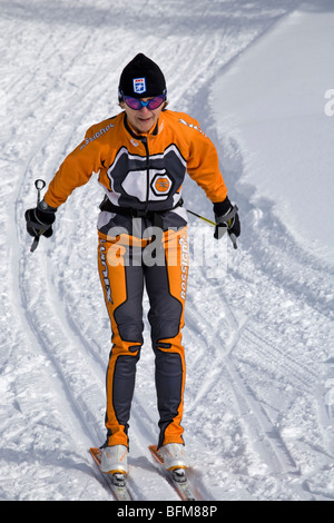 A senior citizen cross country or nordic skiing on skate skis at Mount Bachelor in the Oregon Cascade Mountains Stock Photo