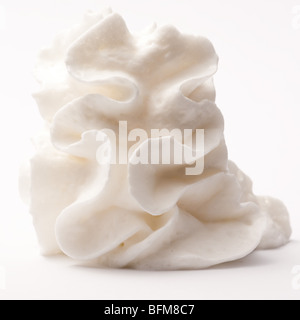 Whipped cream on white background. Stock Photo