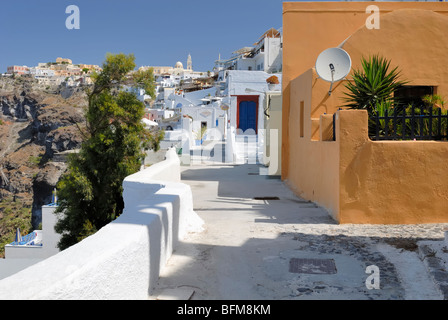 A fine view to the north along Agiou Mina street at a sunny Sunday morning. Fira, Santorini Island (Thira), Cyclades Islands, Gr Stock Photo