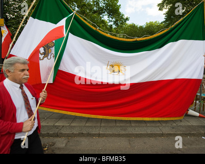 Man holding an iranian flag at protest against the results of the2009 Iranian presidential election  London Stock Photo