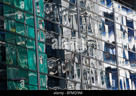 Distorted Cladding Non-structural panels of mirror glass in curtain wall cladding on ...