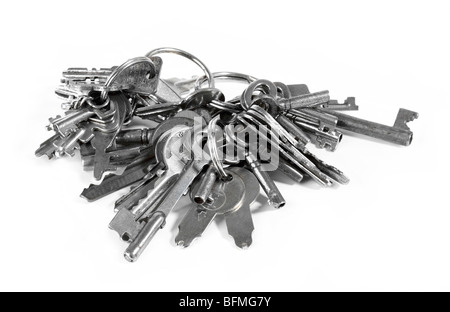 Lots of keys on a keyring shot on white background Stock Photo