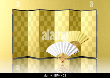 Golden folding screen and fan Stock Photo