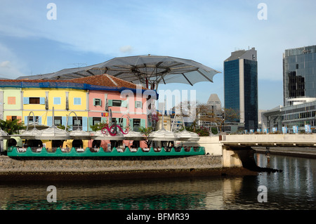 City View of Riverside Bars and Restaurants on Clarke Quay with Singapore River & Skyline of Financial District, Singapore Stock Photo