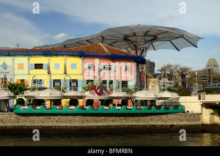 Pastel Coloured Riverside Restaurants & Bars in Restored Colonial Shophouses on Clarke Quay, Singapore River, Singapore Stock Photo