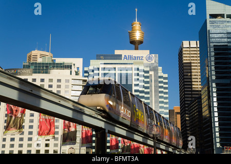 Australia, New South Wales, Sydney.  Monorail at Darling Harbour with the city skyline beyond. Stock Photo