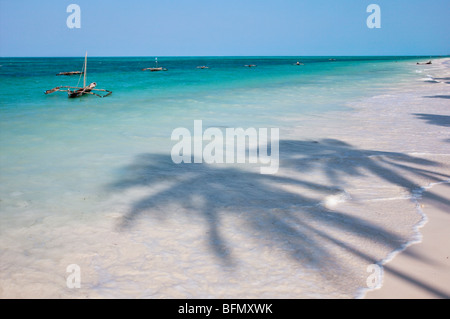The coconut palm-lined beach at Jambiani has one of the finest beaches in the southeast of Zanzibar Island. Stock Photo