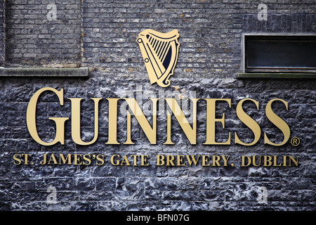 Ireland, Dublin, St James Gate, The Guinness logo and trademark on the wall of the St. James' Gate Brewery. Stock Photo